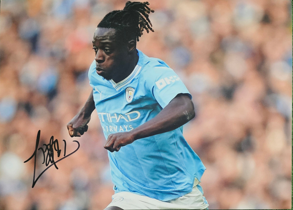Jérémy Doku Signed Manchester City Photos